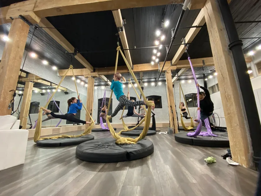 Wide view of the training floor with a hoop rigged